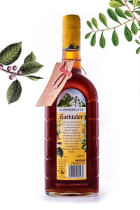 Gurktaler Mei Gurki mit einem Geschenkschild und eingewickelt in Geschenkpapier. 0,7l 27% vol.